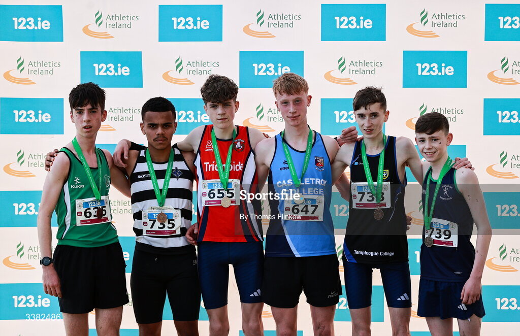 7 March 2026; Inter boys medalists Darragh Whelan of Castletroy College, Limerick, 647, gold, Ruby Devereaux of Pobalscoil na Trionoide, Cork, 655, silver, Adam Noon of Templeogue College, Dublin, 738, bronze, Kyrell Mtinsi of St. Kieran's Kilkenny, 735, fourth, Thomas Coy of St Malachys Belfast, Antrim, 635, fifth, and Sam Redmond of Templeogue College, Dublin, 739, sixth, during the 123.ie All Ireland Schools’ Cross Country Championships at Mallusk Playing Fields in Newtownabbey, Antrim. Photo by Thomas Flinkow/Sportsfile