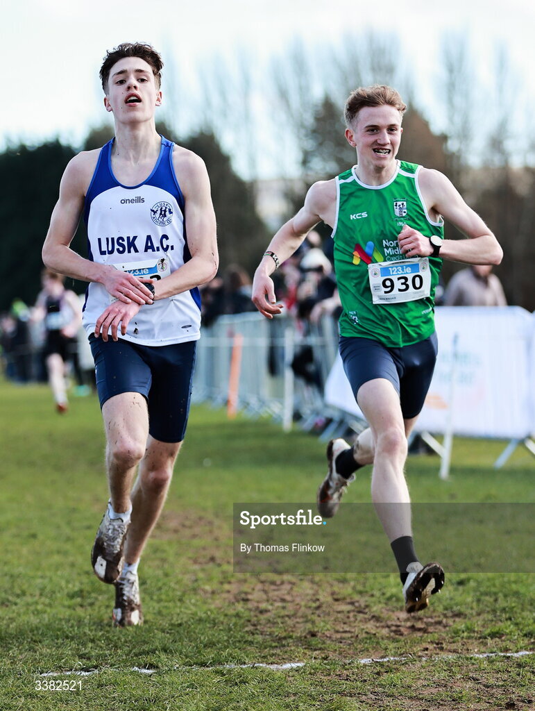 7 March 2026; Conor Mcguirk of Lusk Community College, Dublin, left, and Jamie Wallace of Colaiste Mhuire, Westmeath, compete in the senior boys event during the 123.ie All Ireland Schools’ Cross Country Championships at Mallusk Playing Fields in Newtownabbey, Antrim. Photo by Thomas Flinkow/Sportsfile