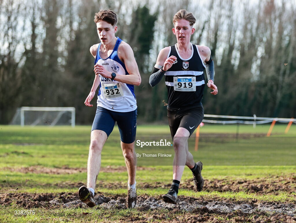 7 March 2026; Conor Mcguirk of Lusk Community College, Dublin, 932, and Liam Morris of Belvedere College, Dublin, compete in the senior boys event during the 123.ie All Ireland Schools’ Cross Country Championships at Mallusk Playing Fields in Newtownabbey, Antrim. Photo by Thomas Flinkow/Sportsfile