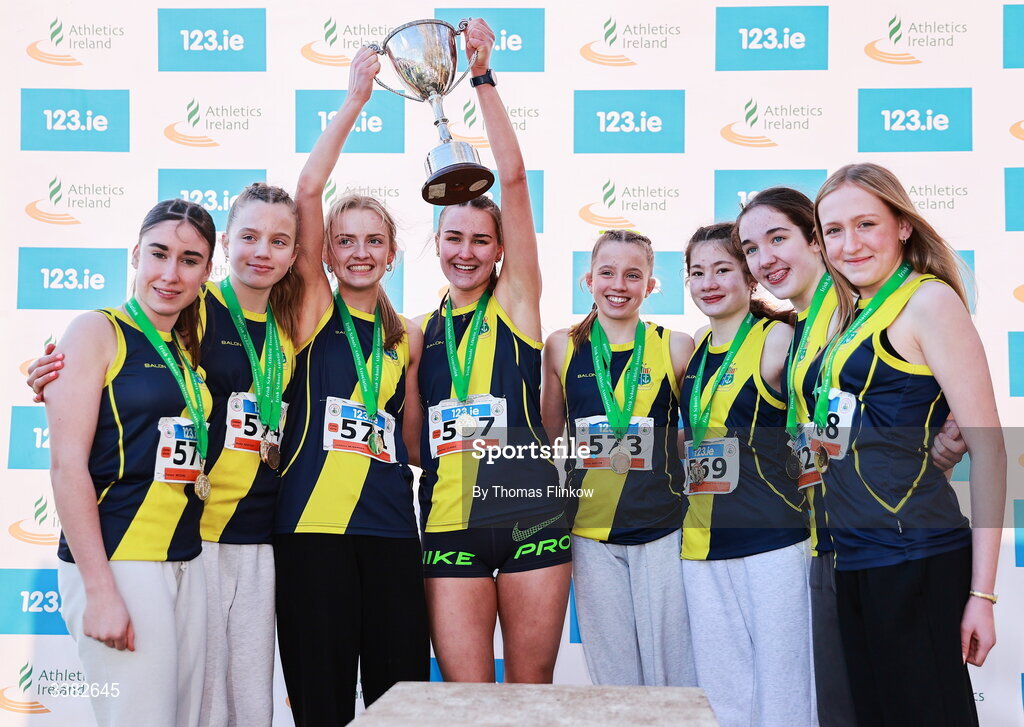 7 March 2026; Inter girls team gold medallists, Sacred Heart School Westport, Mayo, celebrate after the 123.ie All Ireland Schools’ Cross Country Championships at Mallusk Playing Fields in Newtownabbey, Antrim. Photo by Thomas Flinkow/Sportsfile