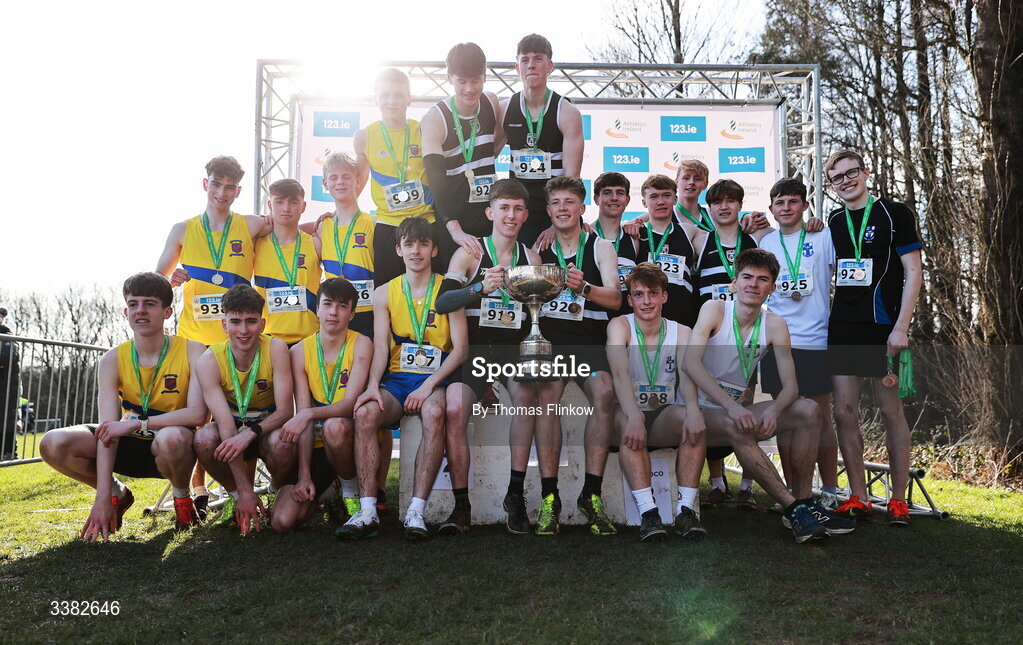 7 March 2026; Senior boys team medallists, Belvedere College, gold, St. Mary's Diocesan School, silver, and Blackrock College, bronze, celebrate after the 123.ie All Ireland Schools’ Cross Country Championships at Mallusk Playing Fields in Newtownabbey, Antrim. Photo by Thomas Flinkow/Sportsfile