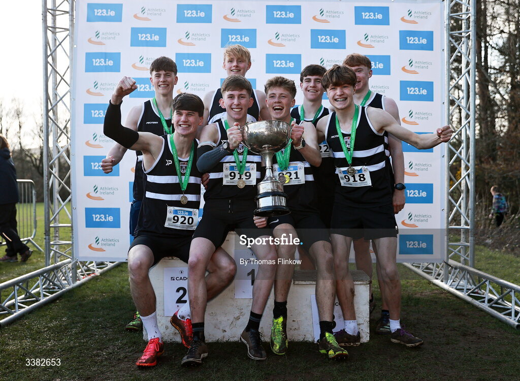 7 March 2026; Senior boys team gold medallists, Belvedere College, celebrate after the 123.ie All Ireland Schools’ Cross Country Championships at Mallusk Playing Fields in Newtownabbey, Antrim. Photo by Thomas Flinkow/Sportsfile