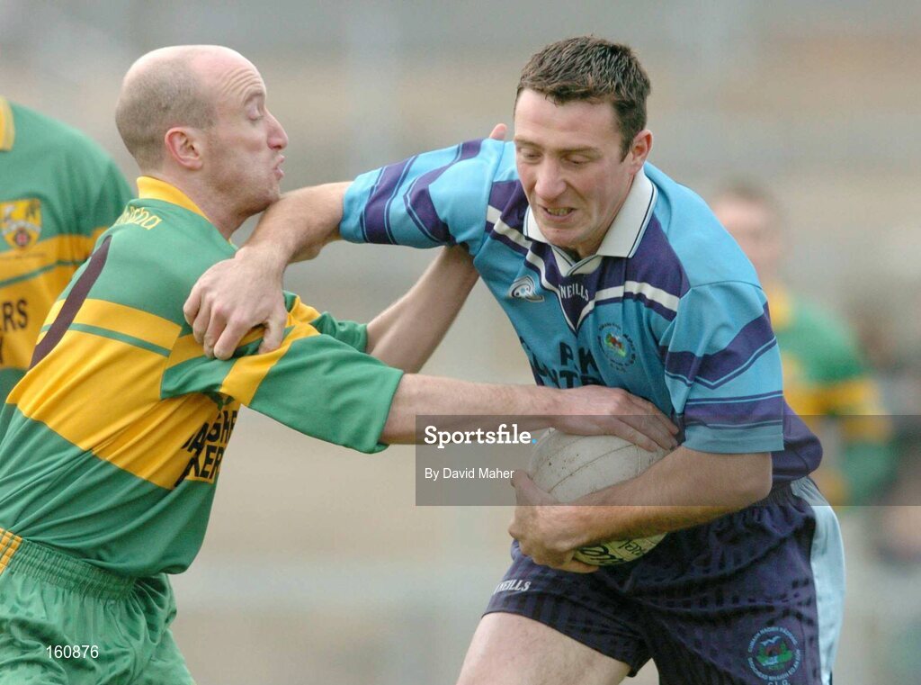 14 November 2004; Eoghan Woods, Mayobridge, is tackled by Michael Doherty, Ardara. AIB Ulster Senior Club Football Championship Quarter Final Replay, Mayobridge v Ardara, Newry, Co. Down. Picture credit; David Maher / SPORTSFILE
