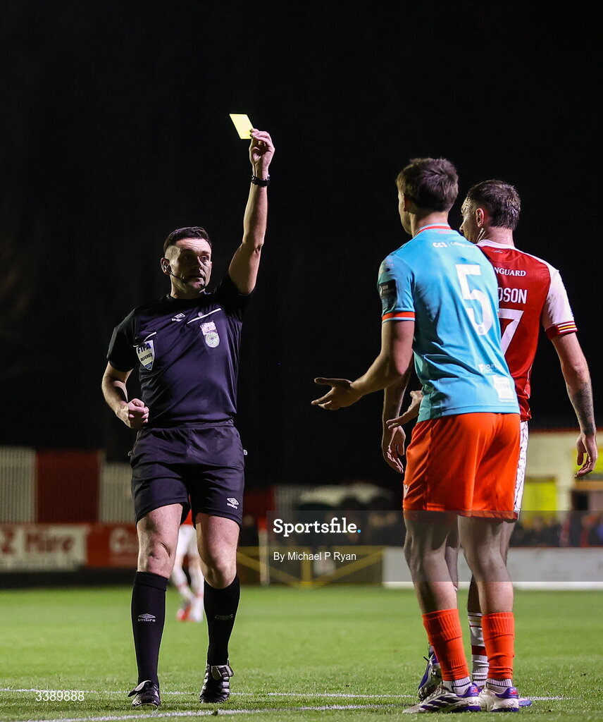 13 March 2026; Leo Burney of Drogheda United is shown a yellow card by referee Rob Hennessy during the SSE Airtricity Men's Premier Division match between St Patrick's Athletic and Drogheda United at Richmond Park in Dublin. Photo by Michael P Ryan/Sportsfile