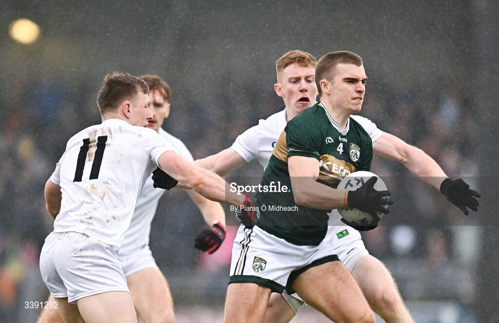 14 March 2026; Dylan Casey of Kerry in action against Ryan O'Donoghue, 11, and David McBrien, right, of Mayo during the Allianz Football League Division 1 match between Kerry and Mayo at Austin Stack Park in Tralee, Kerry. Photo by Piaras Ó Mídheach/Sportsfile