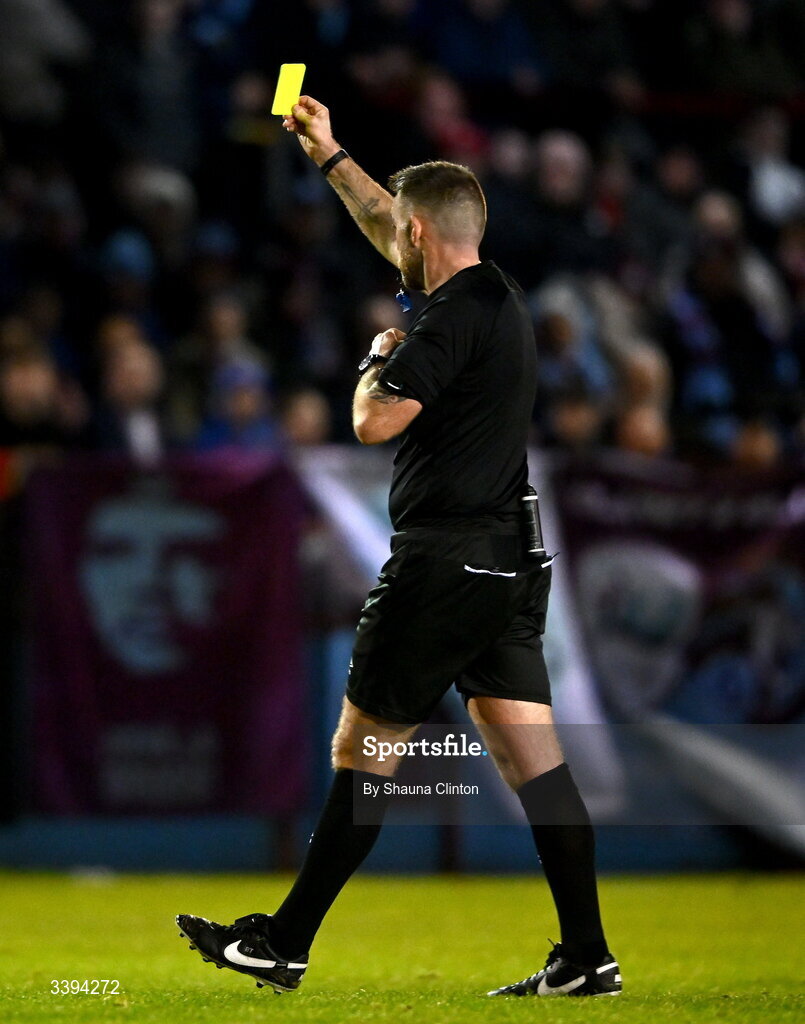 16 March 2026; Referee Declan Toland issues a yellow card to Conor Keeley of Drogheda United, not pictured, during the SSE Airtricity Men's Premier Division match between Drogheda United and Shamrock Rovers at Sullivan & Lambe Park in Drogheda, Louth. Photo by Shauna Clinton/Sportsfile