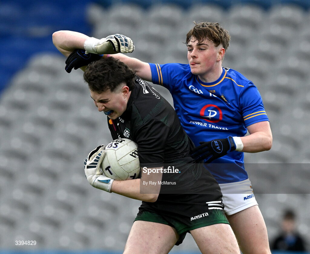 17 March 2026; Coláiste Mhuire Mullingar goalkeeper Adam Buckley clears under pressure from Ryan Hurley of Tralee CBS during the Masita GAA Post Primary Schools Hogan Cup final match between Coláiste Mhuire Mullingar, Westmeath, and Tralee CBS, Kerry,  at Croke Park in Dublin. Photo by Ray McManus/Sportsfile