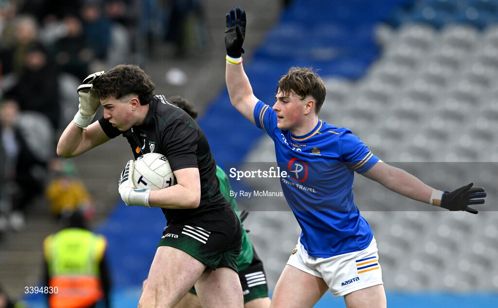 17 March 2026; Coláiste Mhuire Mullingar goalkeeper Adam Buckley clears under pressure from Ryan Hurley of Tralee CBS during the Masita GAA Post Primary Schools Hogan Cup final match between Coláiste Mhuire Mullingar, Westmeath, and Tralee CBS, Kerry,  at Croke Park in Dublin. Photo by Ray McManus/Sportsfile