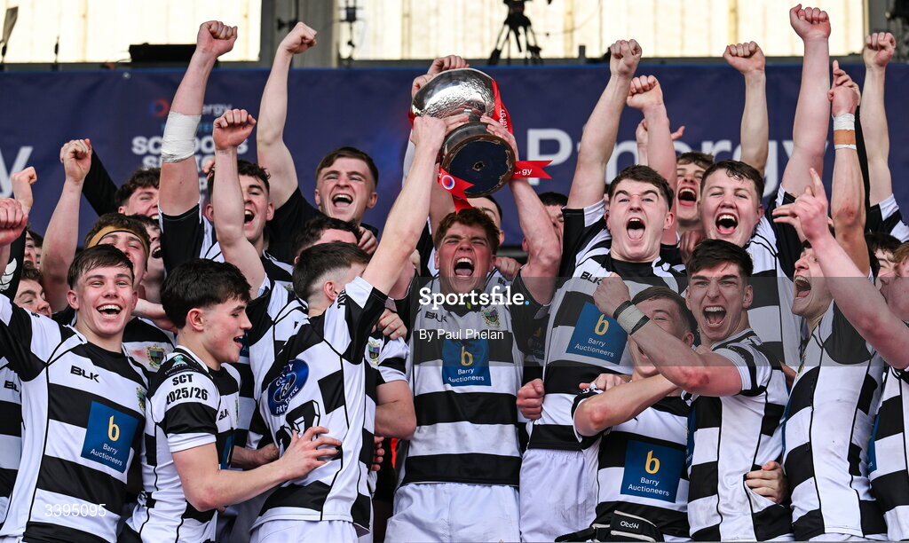 18 March 2026; Rian MacFarlane O'Shea of Presentation Brothers College lifts the Garrett Fitzgerald Cup with his teammates after the Pinergy Munster Schools Boys Senior Cup final match between Presentation Brothers College, Cork and St. Munchin’s College, Limerick at Virgin Media Park in Cork. Photo by Paul Phelan/Sportsfile