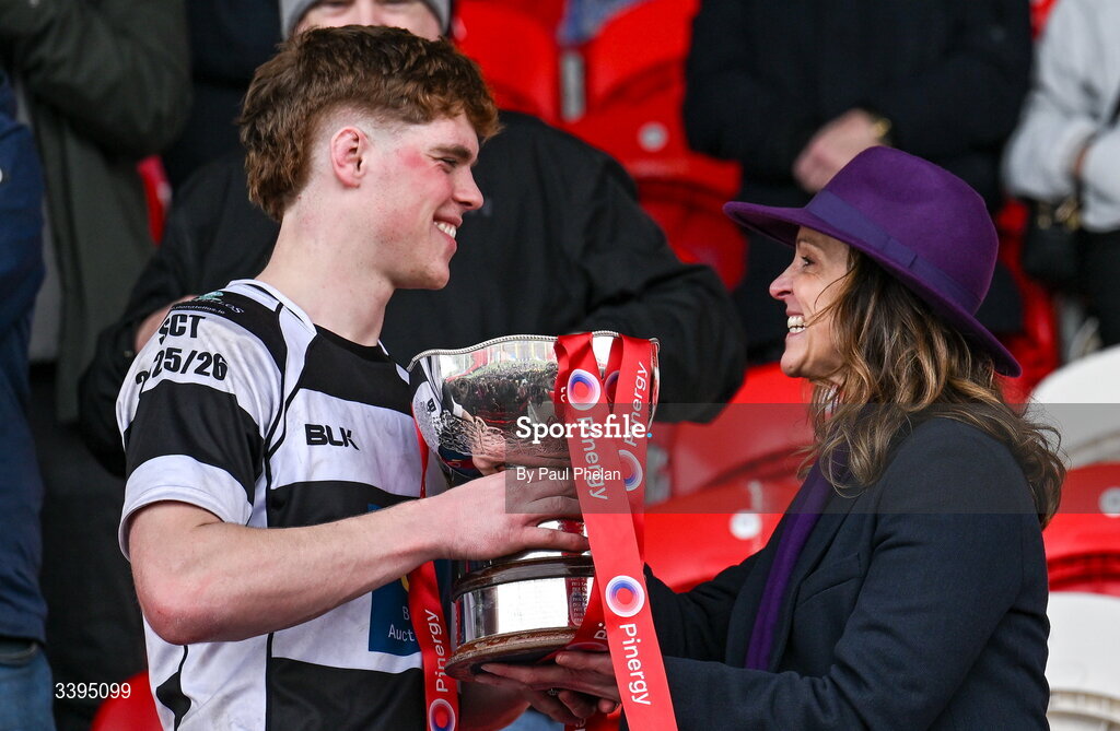 18 March 2026; Rachel O’Shea presents the Garrett Fitzgerald Cup to her son, captain Rian MacFarlane O'Shea, of Presentation Brothers College after the Pinergy Munster Schools Boys Senior Cup final match between Presentation Brothers College, Cork and St. Munchin’s College, Limerick at Virgin Media Park in Cork. Photo by Paul Phelan/Sportsfile