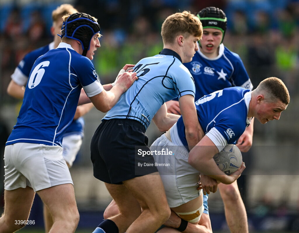 20 March 2026; Adam Brennan of St Mary’s College is tackled by Myles Carroll of St Michael’s College during the Bank of Ireland Leinster Rugby Boys Schools Junior Cup final match between St Mary's College and St Michael's College at Energia Park in Dublin. Photo by Daire Brennan/Sportsfile