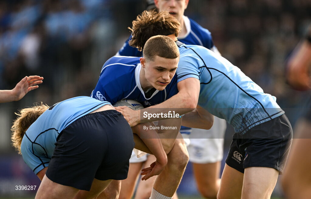 20 March 2026; Nicholas Crawley of St Mary’s College is tackled by James Farrell, left, and CJ Rowell of St Michael’s College during the Bank of Ireland Leinster Rugby Boys Schools Junior Cup final match between St Mary's College and St Michael's College at Energia Park in Dublin. Photo by Daire Brennan/Sportsfile