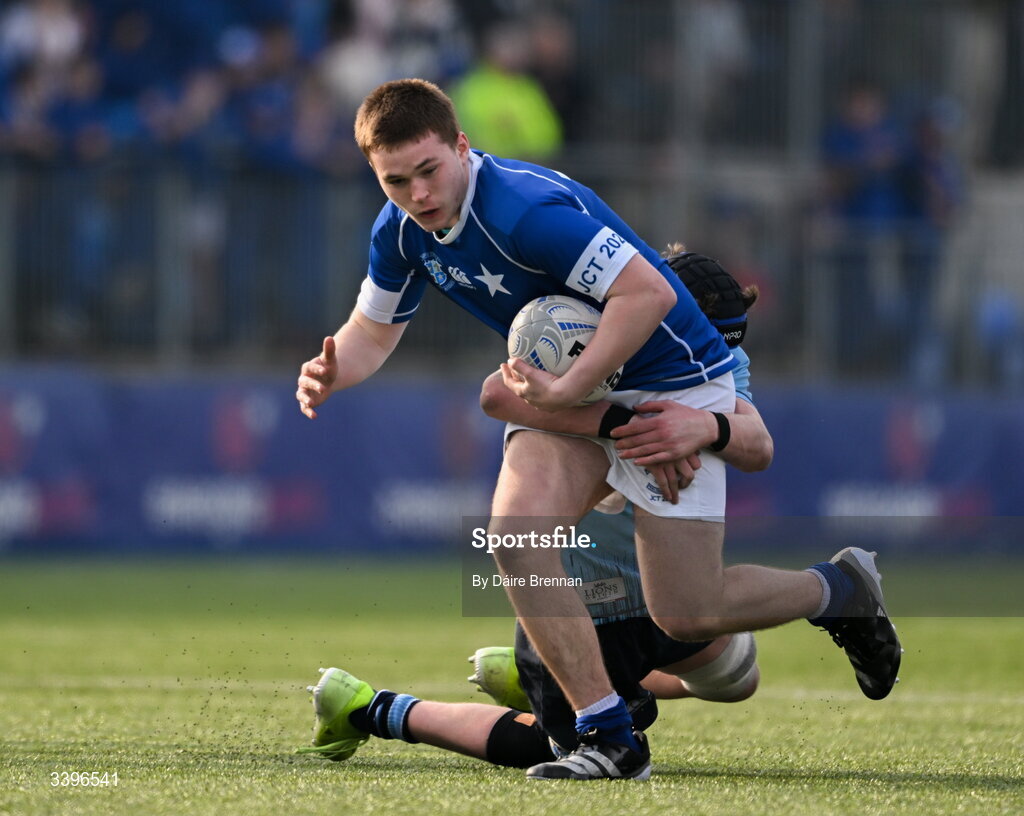 20 March 2026; Evan Chambers of St Mary’s College is tackled by Ryan O’Malley of St Michael’s College during the Bank of Ireland Leinster Rugby Boys Schools Junior Cup final match between St Mary's College and St Michael's College at Energia Park in Dublin. Photo by Daire Brennan/Sportsfile