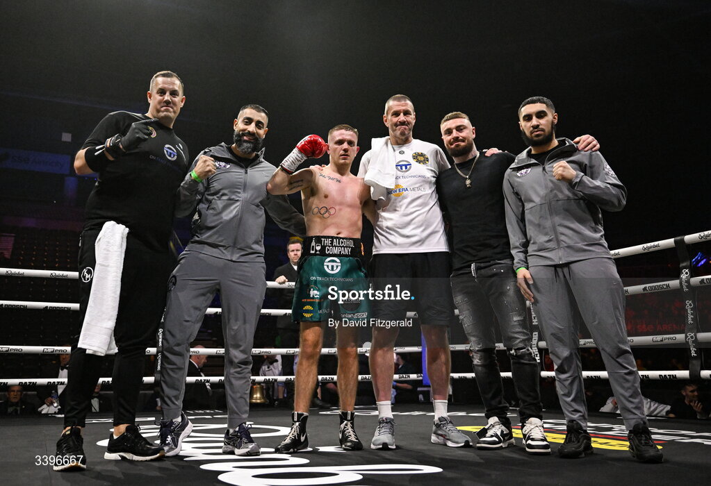 20 March 2026; Kurt Walker celebrates with his backroom team, including Lewis Crocker, second from right, after victory over Yahir Alexander Solorio Morales during their lightweight bout at the SSE Arena in Belfast. Photo by David Fitzgerald/Sportsfile
