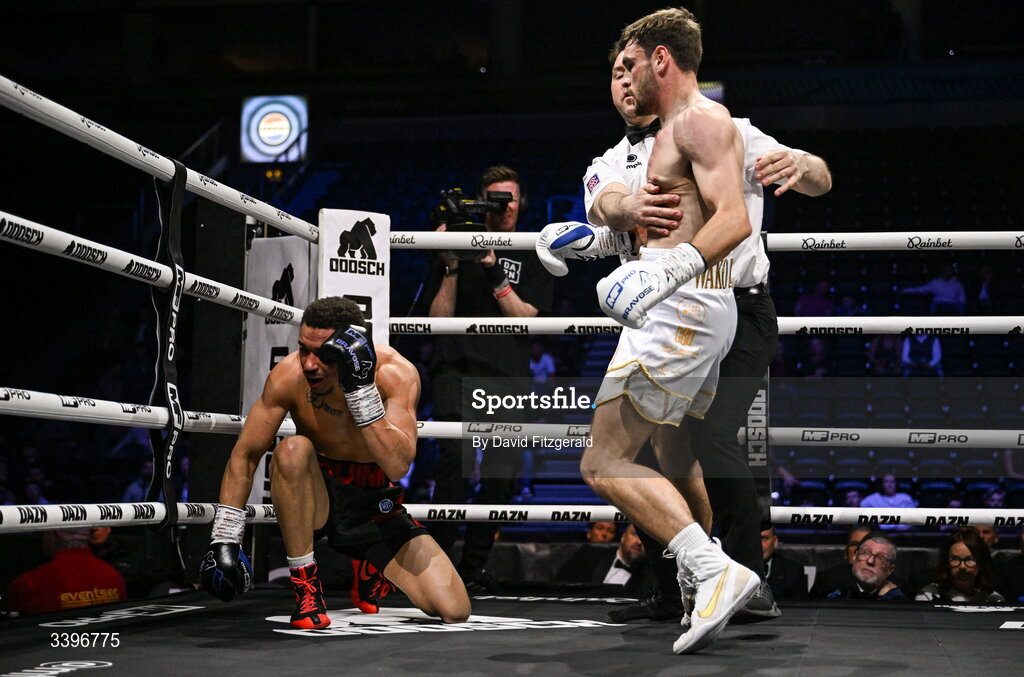 20 March 2026; Jacob Quinn, left, hits the canvas during his super welterweight bout against Jak Corrie at the SSE Arena in Belfast. Photo by David Fitzgerald/Sportsfile