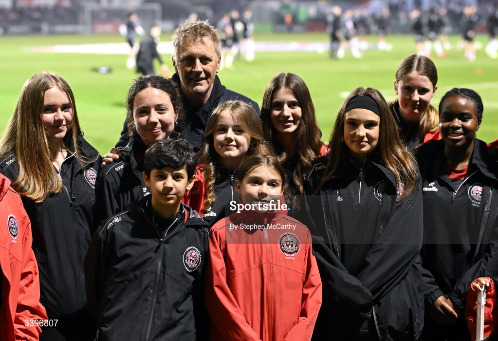 20 March 2026; Republic of Ireland head coach Heimir Hallgrimsson poses for a photograph with the Bohemians U16 team before the SSE Airtricity Men's Premier Division match between Bohemians and Dundalk at Dalymount Park in Dublin. Photo by Stephen McCarthy/Sportsfile