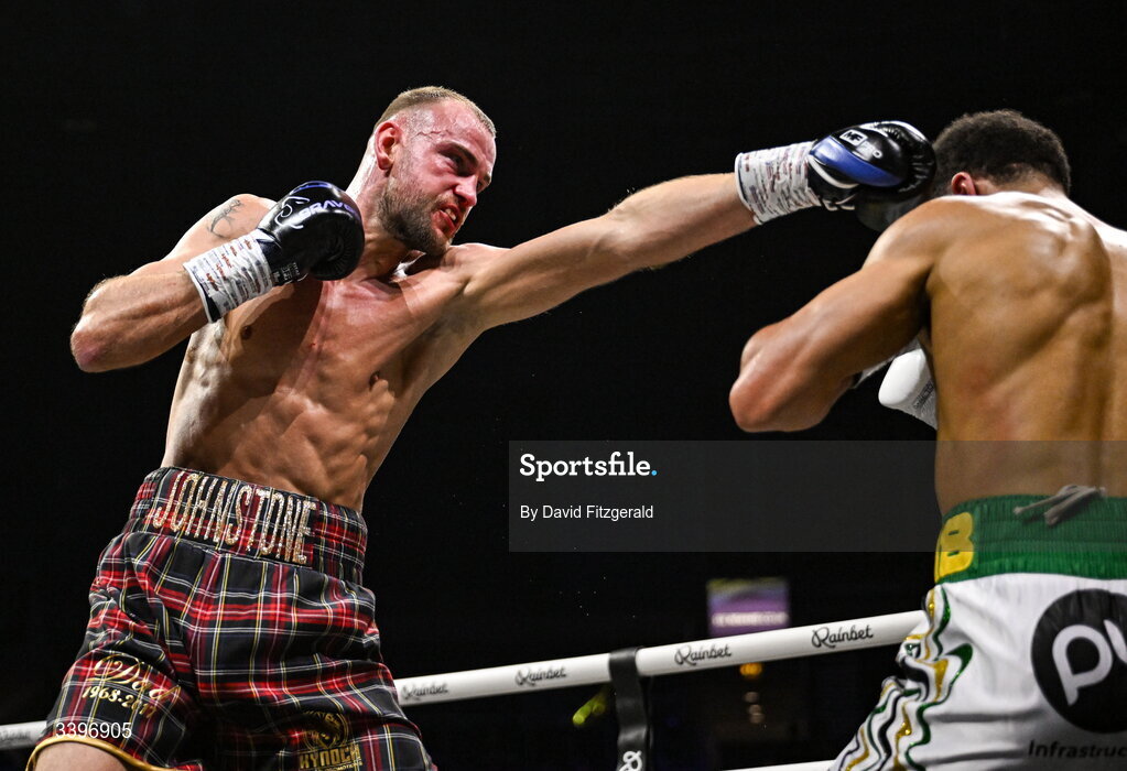20 March 2026; Darren Johnstone, left, trades punches with Niall Browne during their British Super Middleweight Eliminator bout at the SSE Arena in Belfast. Photo by David Fitzgerald/Sportsfile