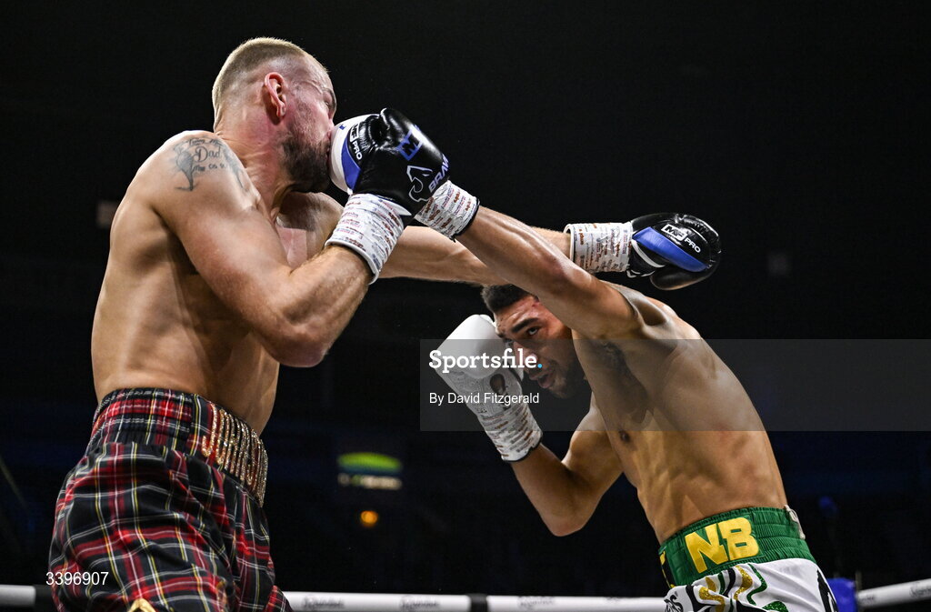20 March 2026; Darren Johnstone, left, trades punches with Niall Browne during their British Super Middleweight Eliminator bout at the SSE Arena in Belfast. Photo by David Fitzgerald/Sportsfile