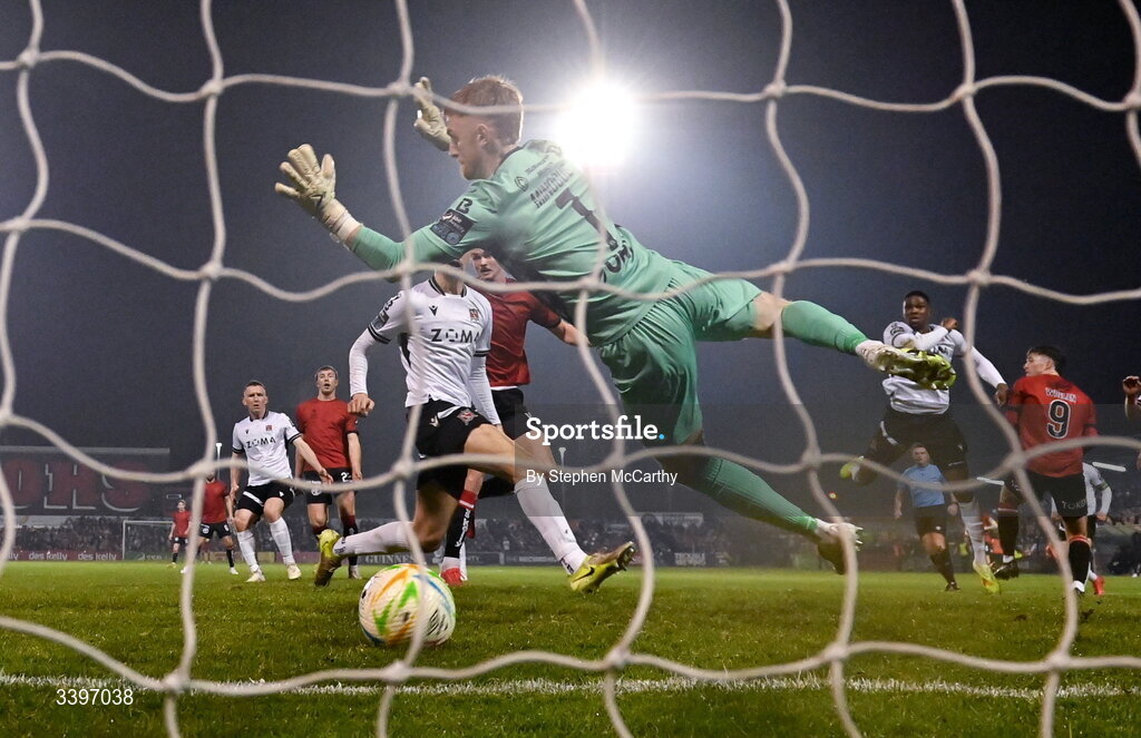 20 March 2026; Patrick Hickey of Bohemians heads his side's first goal past Dundalk goalkeeper Enda Minogue during the SSE Airtricity Men's Premier Division match between Bohemians and Dundalk at Dalymount Park in Dublin. Photo by Stephen McCarthy/Sportsfile
