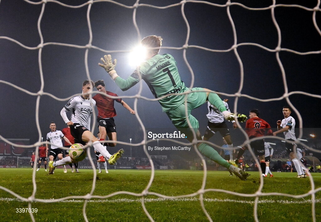 20 March 2026; Patrick Hickey of Bohemians heads his side's first goal past Dundalk goalkeeper Enda Minogue during the SSE Airtricity Men's Premier Division match between Bohemians and Dundalk at Dalymount Park in Dublin. Photo by Stephen McCarthy/Sportsfile