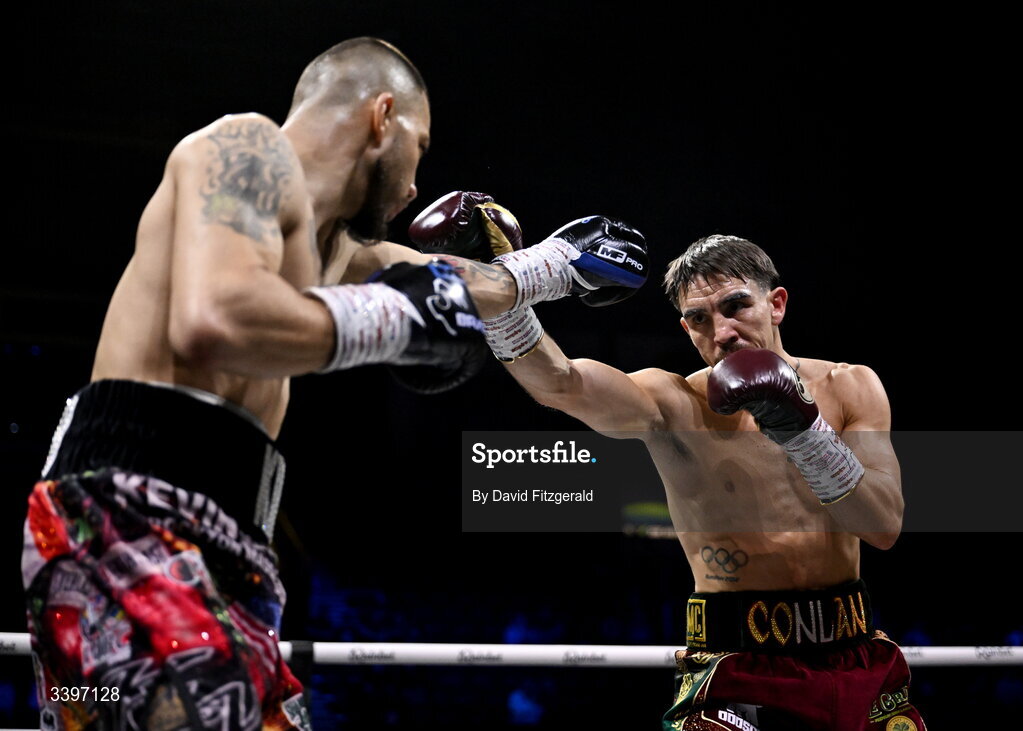 20 March 2026; Michael Conlan, right, in action against Kevin Walsh during their WBC featherweight title fight at the SSE Arena in Belfast. Photo by David Fitzgerald/Sportsfile