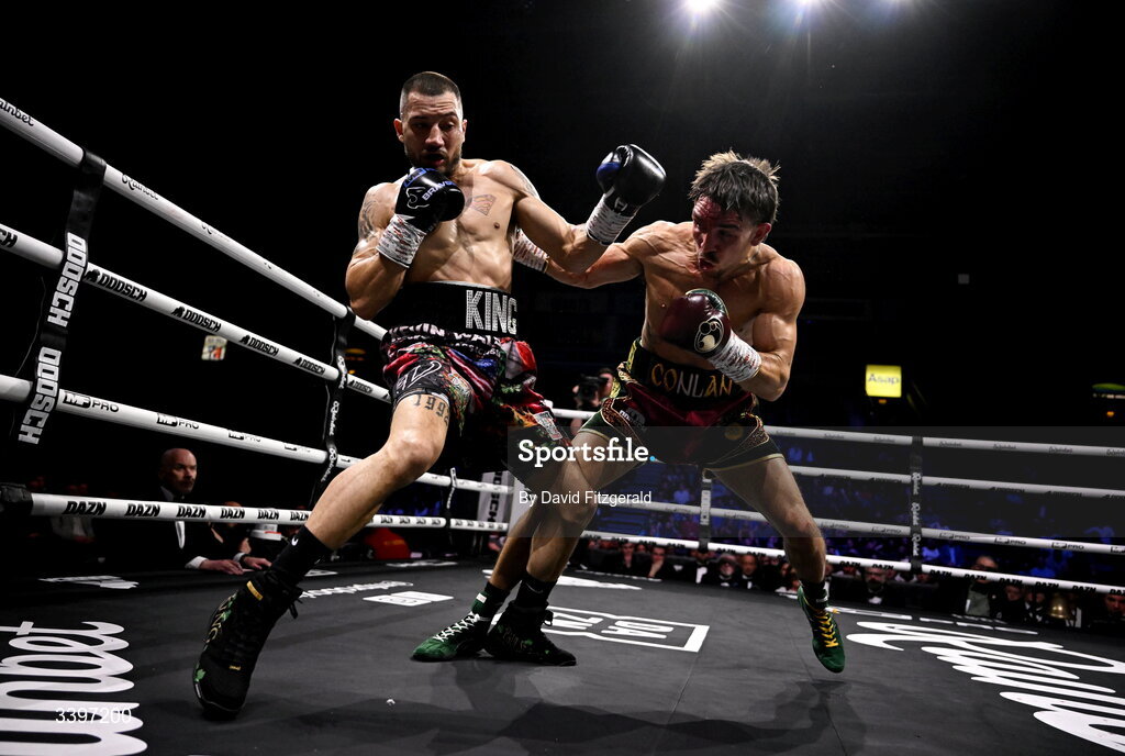 20 March 2026; Michael Conlan, right, in action against Kevin Walsh during their WBC featherweight title fight at the SSE Arena in Belfast. Photo by David Fitzgerald/Sportsfile