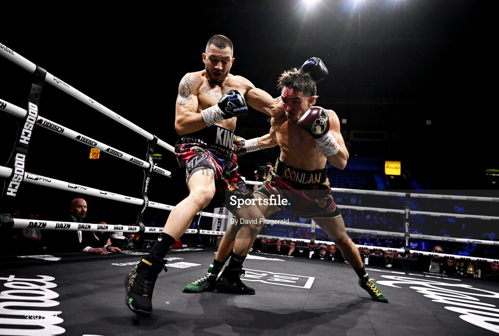 20 March 2026; Michael Conlan, right, in action against Kevin Walsh during their WBC featherweight title fight at the SSE Arena in Belfast. Photo by David Fitzgerald/Sportsfile
