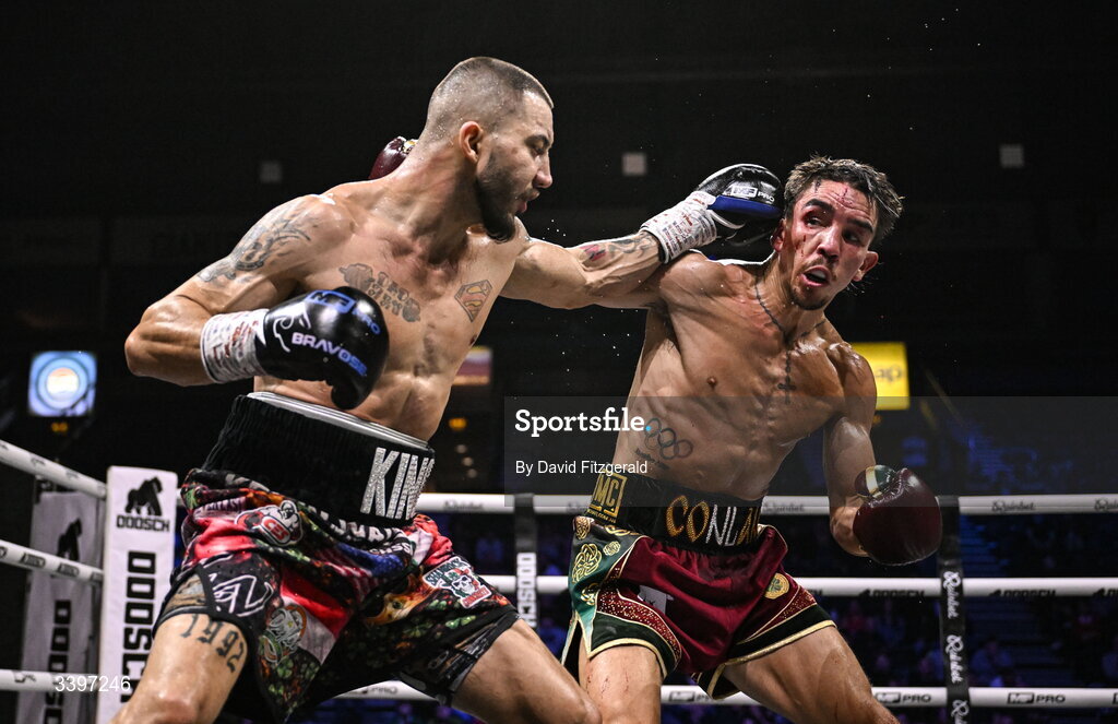 20 March 2026; Kevin Walsh, left, and Michael Conlan exchange punches during their WBC featherweight title fight at the SSE Arena in Belfast. Photo by David Fitzgerald/Sportsfile