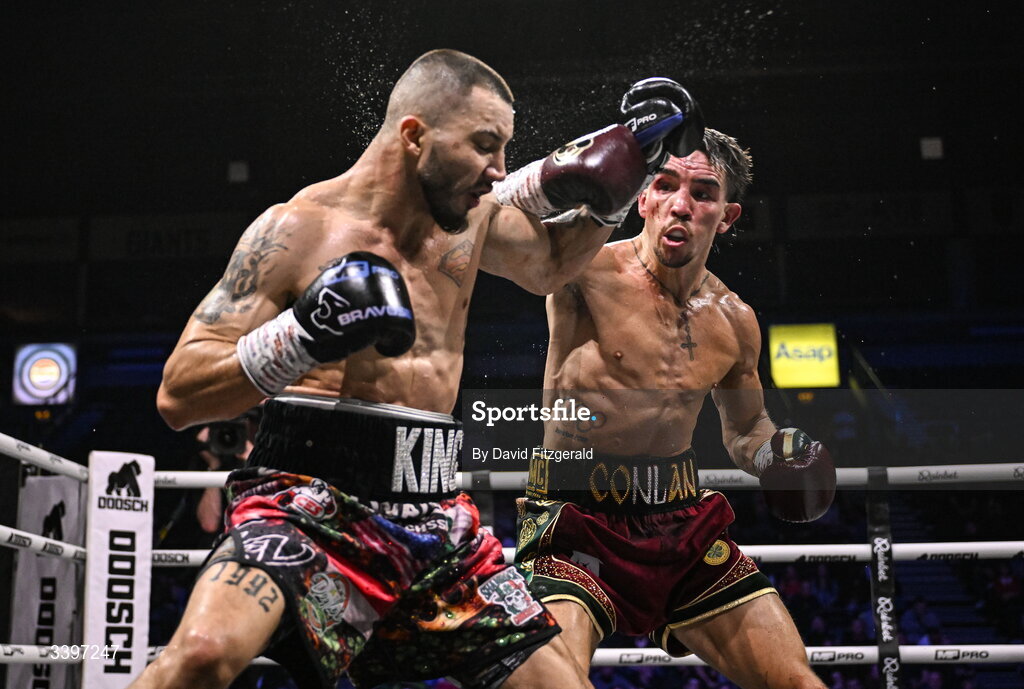 20 March 2026; Michael Conlan, right, in action against Kevin Walsh during their WBC featherweight title fight at the SSE Arena in Belfast. Photo by David Fitzgerald/Sportsfile