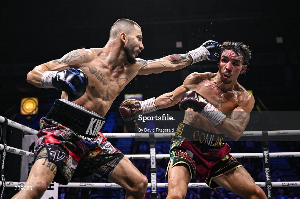 20 March 2026; Kevin Walsh, left, and Michael Conlan exchange punches during their WBC featherweight title fight at the SSE Arena in Belfast. Photo by David Fitzgerald/Sportsfile