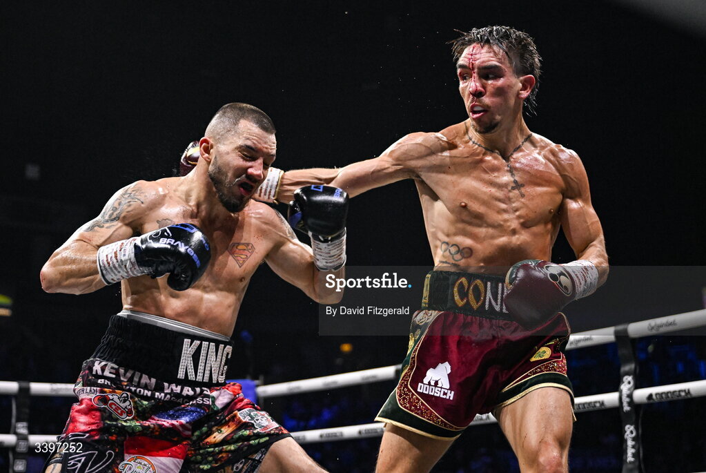 20 March 2026; Michael Conlan, right, in action against Kevin Walsh during their WBC featherweight title fight at the SSE Arena in Belfast. Photo by David Fitzgerald/Sportsfile
