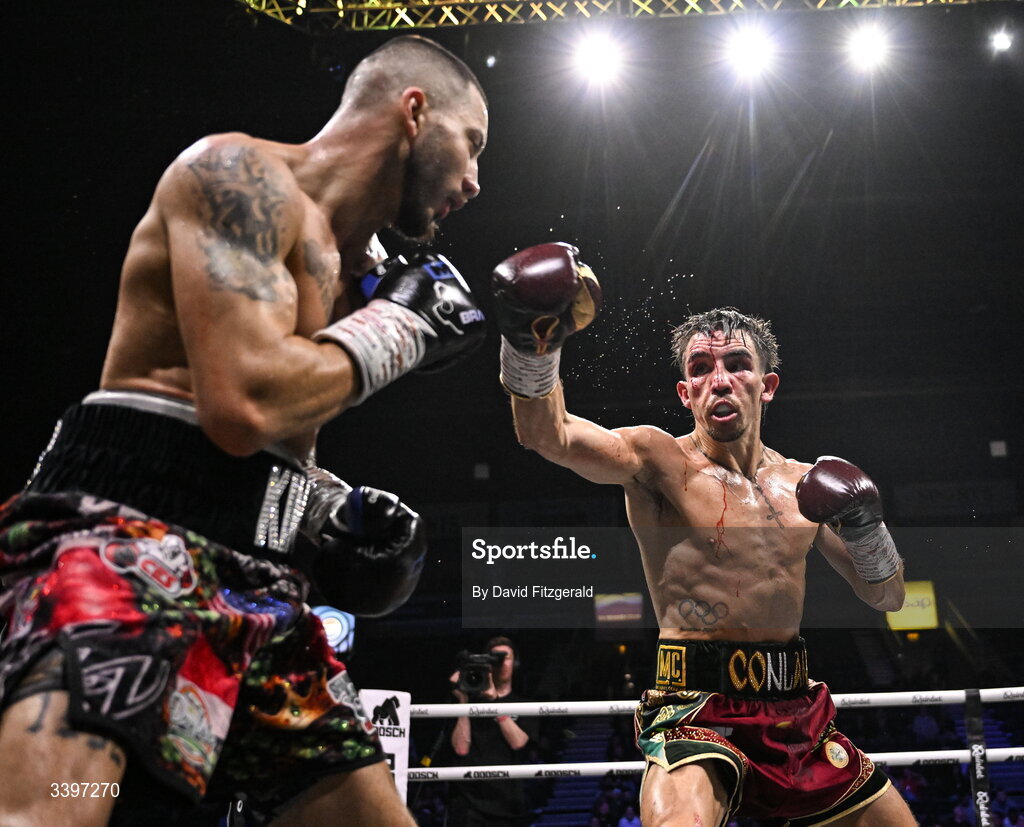 20 March 2026; Michael Conlan, right, in action against Kevin Walsh during their WBC featherweight title fight at the SSE Arena in Belfast. Photo by David Fitzgerald/Sportsfile