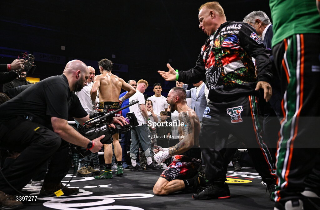 20 March 2026; Michael Conlan, left, walks away after being defeated by Kevin Walsh, centre, in their WBC featherweight title fight at the SSE Arena in Belfast. Photo by David Fitzgerald/Sportsfile