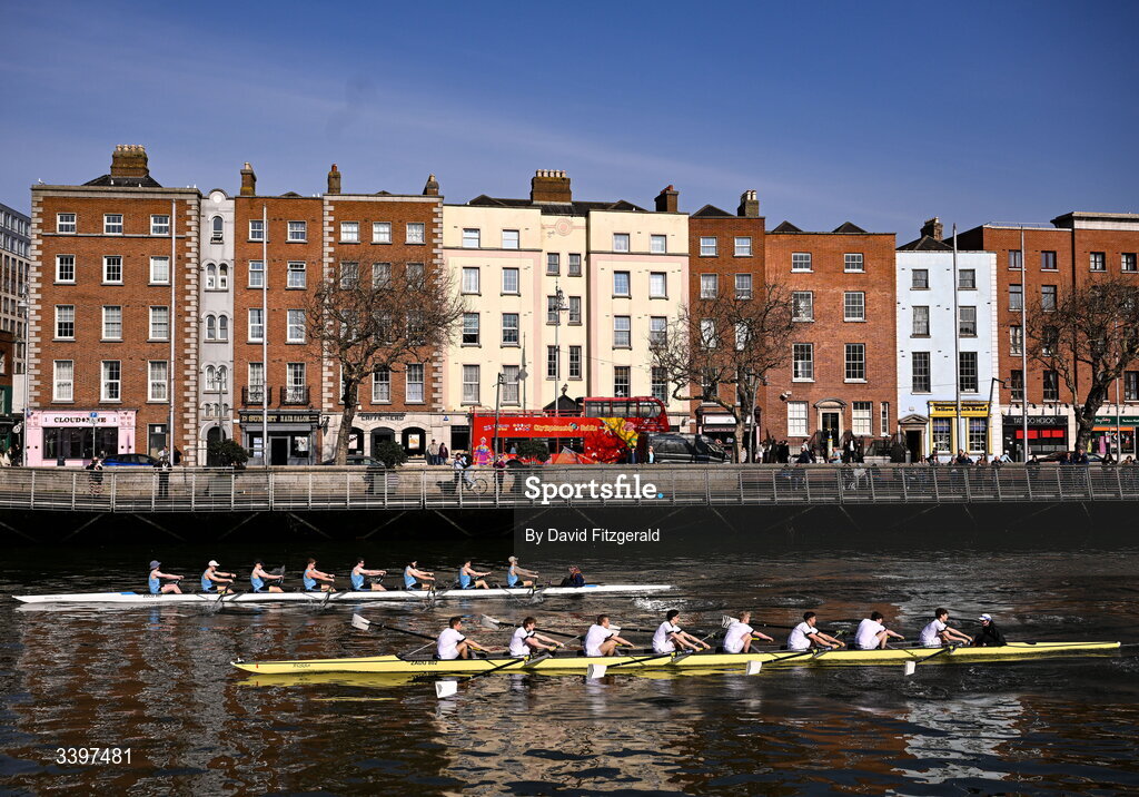 21 March 2026; The UCD Men's junior team, left, bow to stern, Josh Hanson, Matthew Gilson, Daithi Bowen, Luke Boyle, Luke Duffy, Jan Mizak, Senan Tighe, Cuan Moore, and cox Nisha Woolworth, contest the Dan Quinn Shield against the Trinity College junior team, bow to stern, Bjoern Martin, Phillip Cubbin, Odysseus Leonidoue, Hugo Faulkner, George Goor, Ethan Belleaubre, Cormac Lynch, and cox Emily Carrington during the 76th annual Colours Boat Race between UCD and Trinity College on the River Liffey in Dublin. Photo by David Fitzgerald/Sportsfile