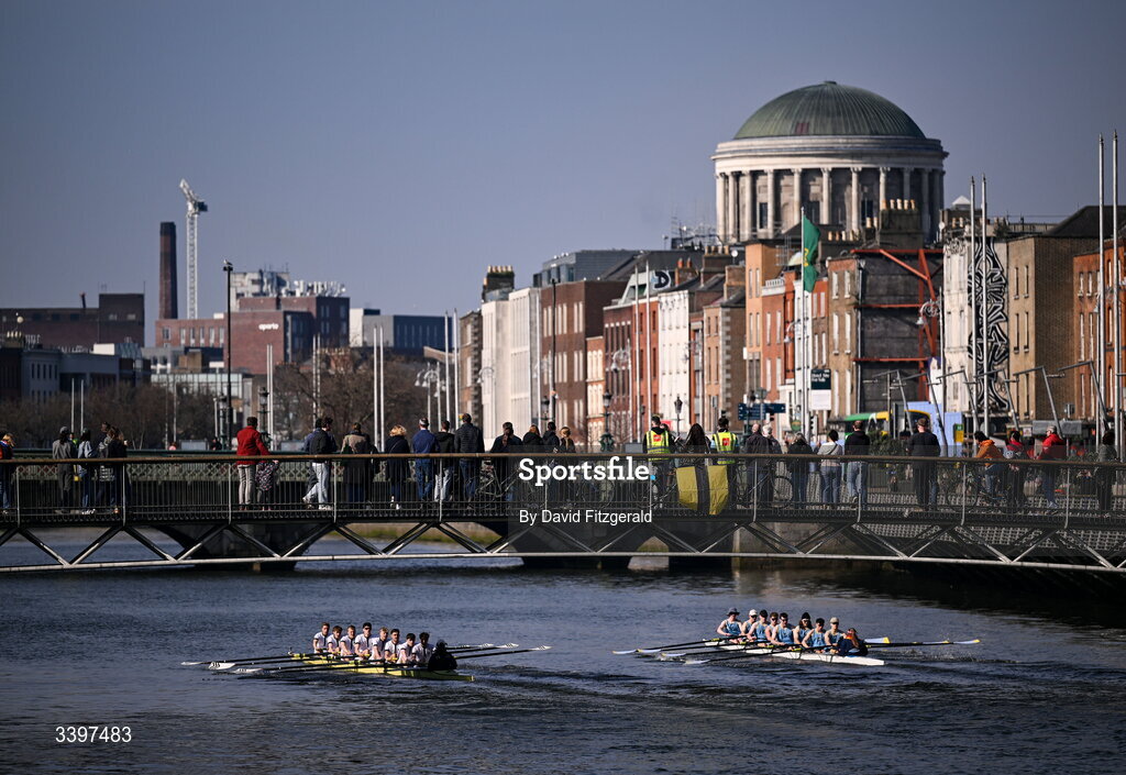 21 March 2026; The UCD Men's junior team, right, bow to stern, Josh Hanson, Matthew Gilson, Daithi Bowen, Luke Boyle, Luke Duffy, Jan Mizak, Senan Tighe, Cuan Moore, and cox Nisha Woolworth, contest the Dan Quinn Shield against the Trinity College junior team, bow to stern, Bjoern Martin, Phillip Cubbin, Odysseus Leonidoue, Hugo Faulkner, George Goor, Ethan Belleaubre, Cormac Lynch, and cox Emily Carrington during the 76th annual Colours Boat Race between UCD and Trinity College on the River Liffey in Dublin. Photo by David Fitzgerald/Sportsfile