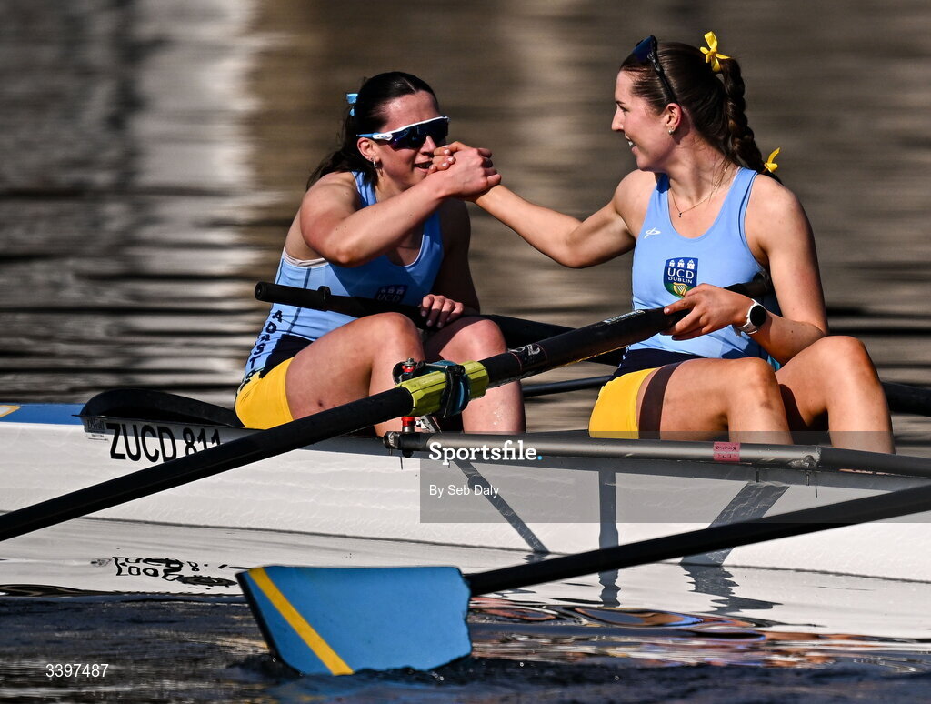21 March 2026; UCD Women’s Novice Eights team members Eilís Mullane, left, and Alison Callinan celebrate after winning the Women’s Novice Eights race for the Sally Moorhead Trophy during the 76th annual Colours Boat Race between UCD and Trinity College on the River Liffey in Dublin. Photo by Seb Daly/Sportsfile
