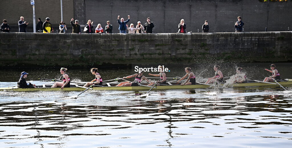 21 March 2026; Trinity College Women’s Senior Eights team, bow to stern, Izzy Howley, Sarah Geoghegan, Danielle Lohrenz, Caoimhe Keller, Jen Forde, Ginevra Guglielmi, María Mezquita García-Poggio, Addy Telzrow, and cox Ava Dolan, celebrate after winning the Women’s Senior Eights race for the Corcoran Cup during the 76th annual Colours Boat Race between UCD and Trinity College on the River Liffey in Dublin. Photo by Seb Daly/Sportsfile