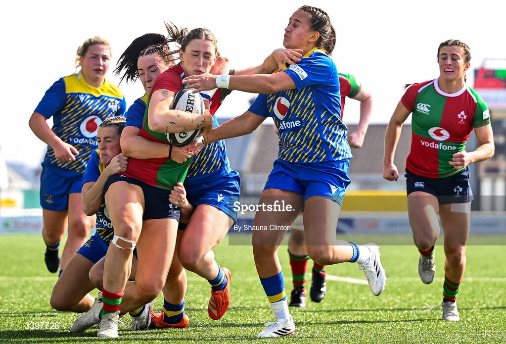 21 March 2026; Anna McGann of Clovers is tackled by Gwennan Hopkins of Gwalia Lightning during the Celtic Challenge semi-final match between Clovers and Gwalia Lightning at Dexcom Stadium in Galway. Photo by Shauna Clinton/Sportsfile
