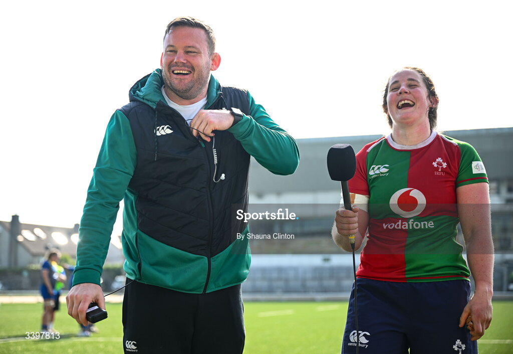 21 March 2026; Clovers head coach Denis Fogarty and player Enya Breen share a joke during a post-match interview after the Celtic Challenge semi-final match between Clovers and Gwalia Lightning at Dexcom Stadium in Galway. Photo by Shauna Clinton/Sportsfile