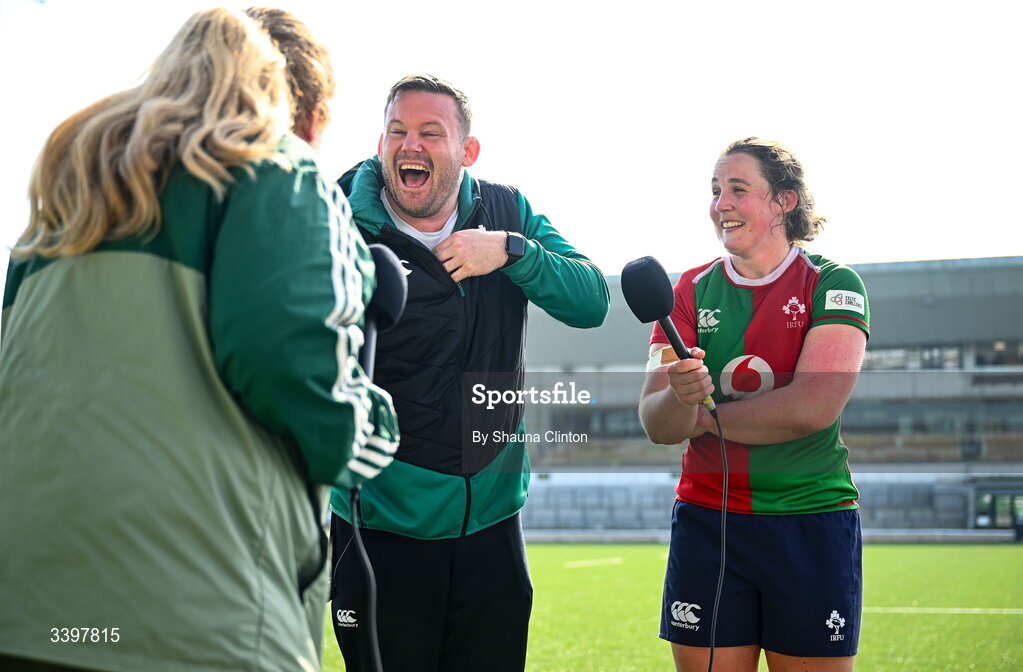 21 March 2026; Clovers head coach Denis Fogarty and player Enya Breen, share a joke with rugby pundit Fiona Hayes after the Celtic Challenge semi-final match between Clovers and Gwalia Lightning at Dexcom Stadium in Galway. Photo by Shauna Clinton/Sportsfile
