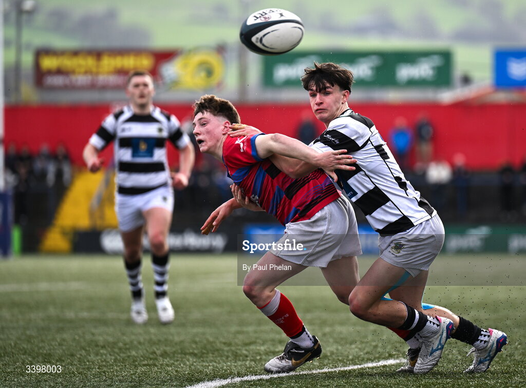 18 March 2026; Bobby O’Callaghan of Presentation Brothers College and Thomas O'Brien of St. Munchin’s College compete for the ball during the Pinergy Munster Schools Boys Senior Cup final match between Presentation Brothers College, Cork and St. Munchin’s College, Limerick at Virgin Media Park in Cork. Photo by Paul Phelan/Sportsfile