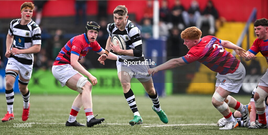 18 March 2026; Alex Moloney of Presentation Brothers College escapes the tackle of Conor Dillon of St. Munchin’s College during the Pinergy Munster Schools Boys Senior Cup final match between Presentation Brothers College, Cork and St. Munchin’s College, Limerick at Virgin Media Park in Cork. Photo by Paul Phelan/Sportsfile