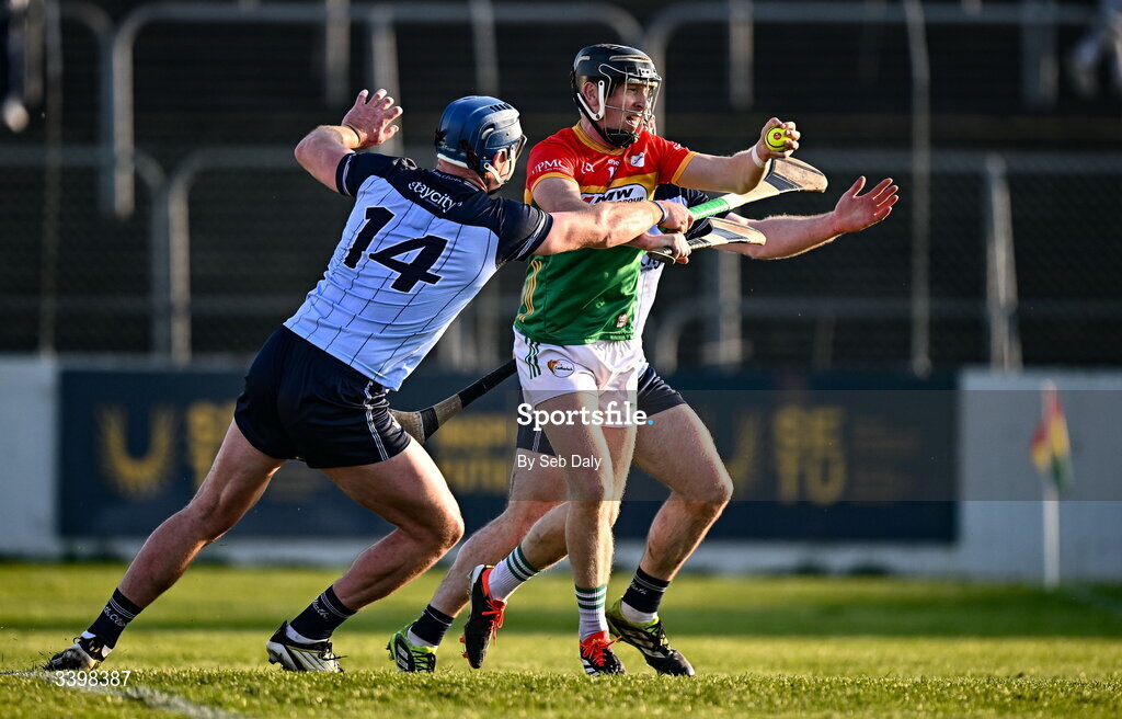 21 March 2026; Richard Coady of Carlow in action against Dublin players John Hetherton, 14, and Cian O’Sullivan, behind, during the Allianz Hurling League Division 1B match between Carlow and Dublin at Netwatch Cullen Park in Carlow. Photo by Seb Daly/Sportsfile