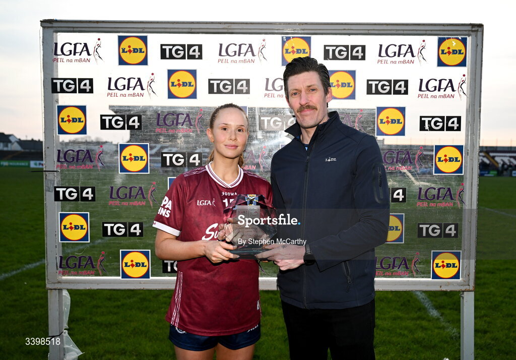21 March 2026; Olivia Divilly of Galway is presented with the Player of the Match Award by Andy Nolan, Store Manager, Lidl Tuam, following the Lidl Ladies National Football League Division 1 Round 6 match between Galway and Dublin at Tuam Stadium in Tuam, Galway. Photo by Stephen McCarthy/Sportsfile