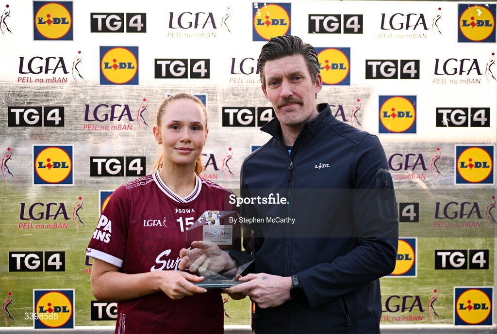 21 March 2026; Olivia Divilly of Galway is presented with the Player of the Match Award by Andy Nolan, Store Manager, Lidl Tuam, following the Lidl Ladies National Football League Division 1 Round 6 match between Galway and Dublin at Tuam Stadium in Tuam, Galway. Photo by Stephen McCarthy/Sportsfile