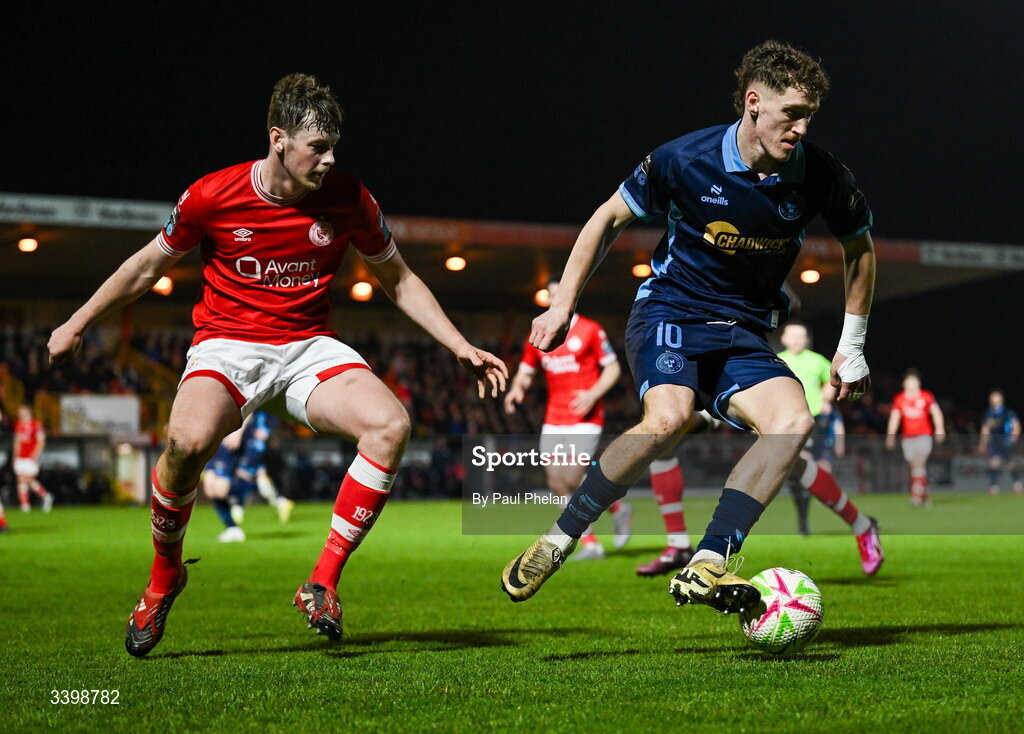 21 March 2026; John Martin of Shelbourne in action against Ollie Denham of Sligo Rovers during the SSE Airtricity Men's Premier Division match between Sligo Rovers and Shelbourne at The Showgrounds in Sligo. Photo by Paul Phelan/Sportsfile