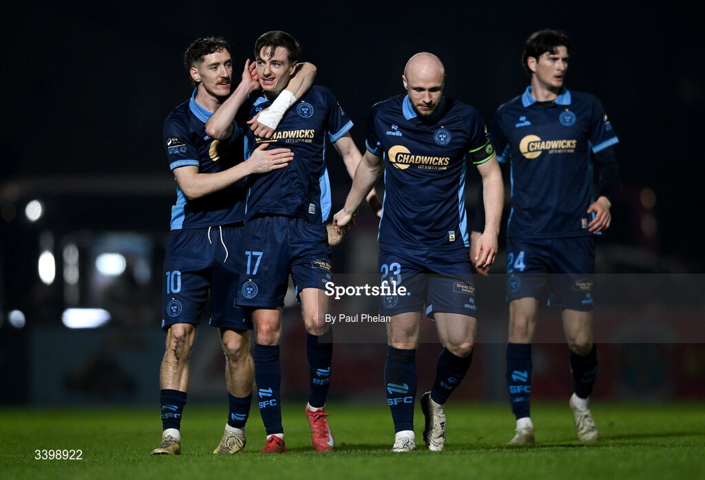 21 March 2026; Daniel Kelly of Shelbourne celebrates after scoring his side's first goal with John Martin and Kerr McInroy of Shelbourne during the SSE Airtricity Men's Premier Division match between Sligo Rovers and Shelbourne at The Showgrounds in Sligo. Photo by Paul Phelan/Sportsfile