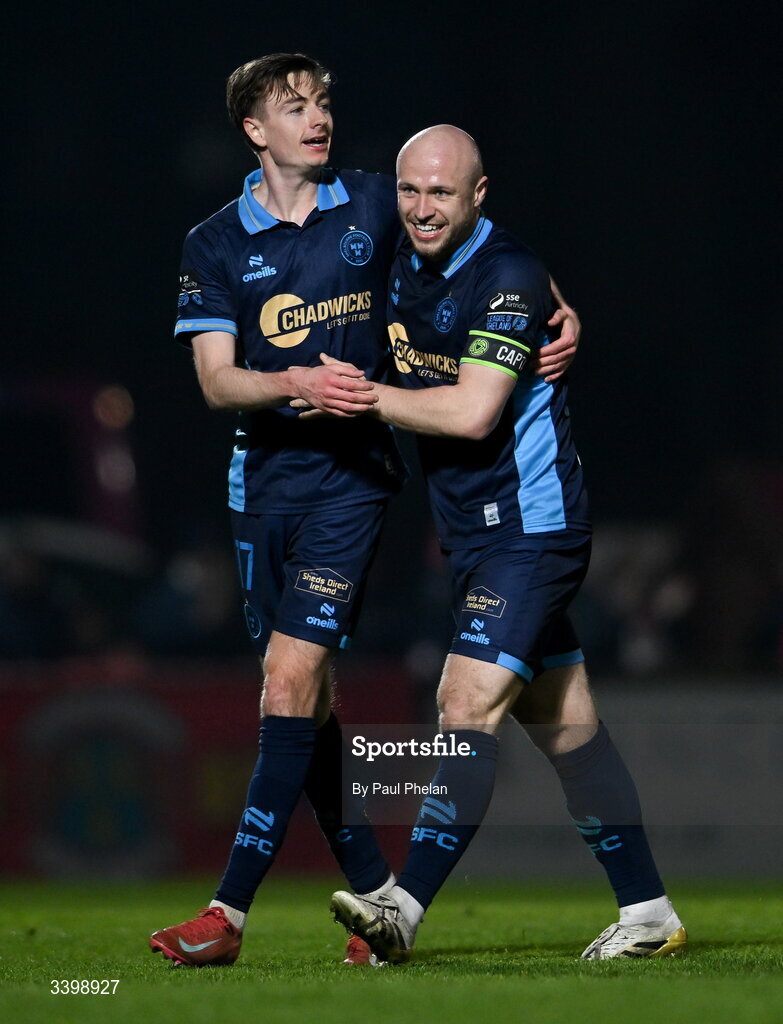 21 March 2026; Daniel Kelly of Shelbourne celebrates after scoring his side's first goal with Kerr McInroy of Shelbourne during the SSE Airtricity Men's Premier Division match between Sligo Rovers and Shelbourne at The Showgrounds in Sligo. Photo by Paul Phelan/Sportsfile