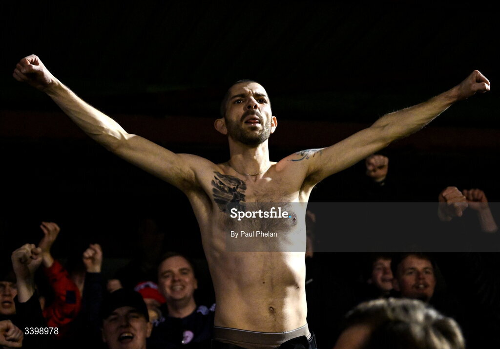 21 March 2026; A Shelbourne supporter celebrates after the SSE Airtricity Men's Premier Division match between Sligo Rovers and Shelbourne at The Showgrounds in Sligo. Photo by Paul Phelan/Sportsfile