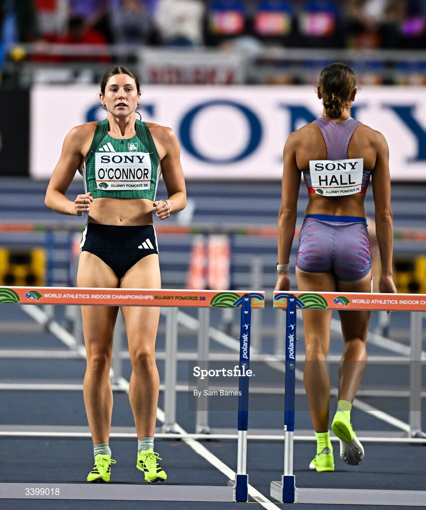 22 March 2026; Kate O'Connor of Ireland, left, and Anna Hall of United States prepare to compete in the Women's 60m hurdles event in the Women's Pentathlon during day three of the World Athletics Indoor Championships at Kujawsko-Pomorska Arena in Torun, Poland. Photo by Sam Barnes/Sportsfile